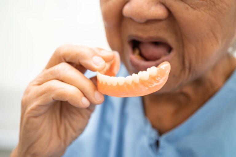 asian elderly woman patient holding to use denture 2024 04 09 17 26 26 utc 1